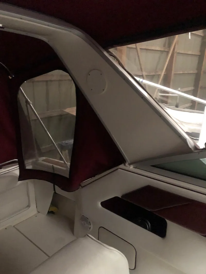 Slide: The Image of Interior view of 1989 Sea Ray 280 Sundancer boat with maroon accents. - 41