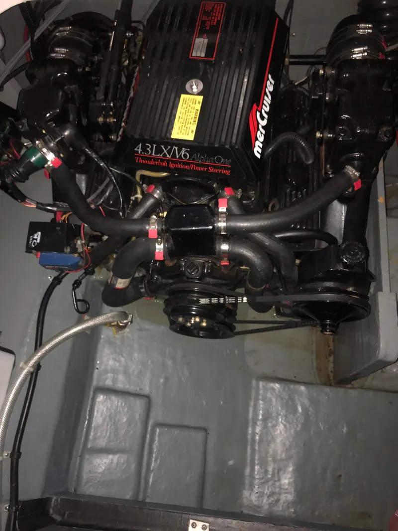 Slide: The Image of 1989 Sea Ray 280 Sundancer engine compartment with MerCruiser 4.3L V6 engine. - 46