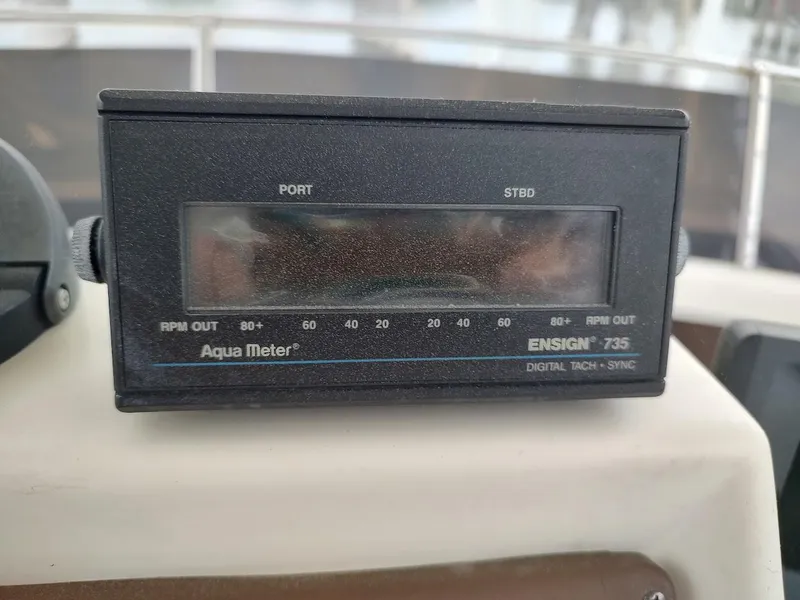 Slide: The Image of Digital tachometer on 1988 Trojan F32 Sedan boat dashboard, displaying RPM readings. - 22