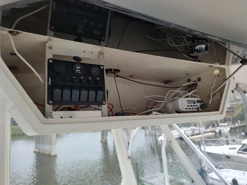 Slide: The Image of Electrical panel inside a 1988 Trojan F32 Sedan boat, showing wiring and controls. - 24