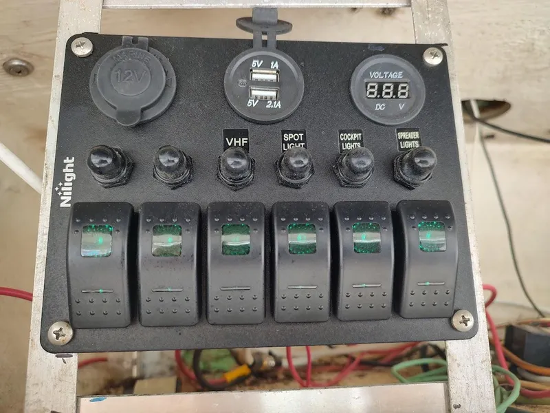 Slide: The Image of Control panel with switches and USB ports on a 1988 Trojan F32 Sedan. - 25