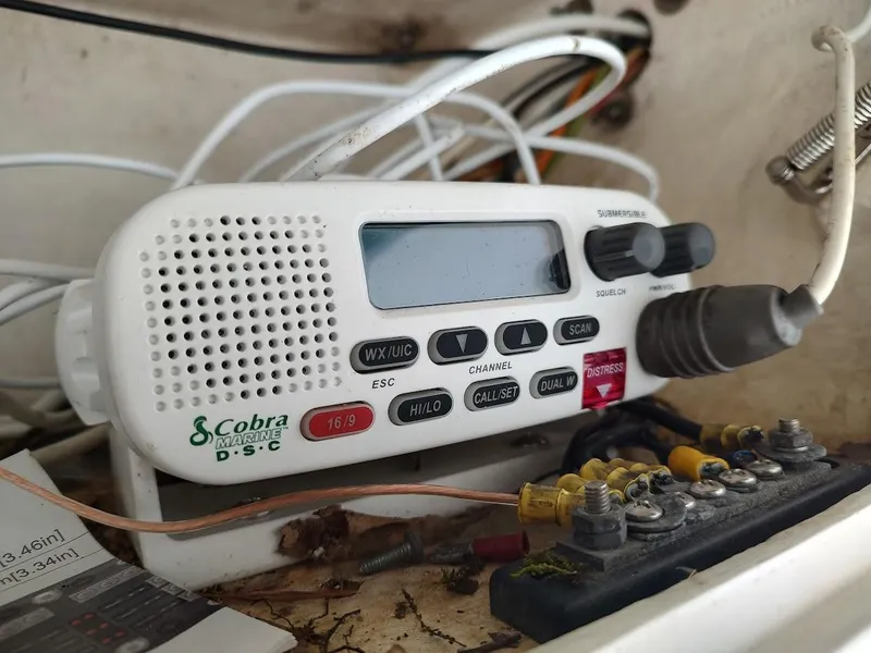 Slide: The Image of Cobra Marine DSC radio in a 1988 Trojan F32 Sedan boat, surrounded by wiring. - 26