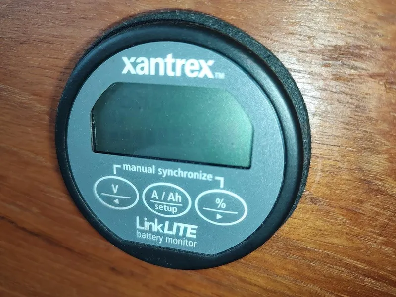 Slide: The Image of Xantrex LinkLITE battery monitor on wood panel, Trojan F32 Sedan 1988. - 42