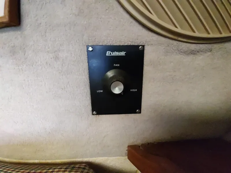 Slide: The Image of Cruisair fan control panel in 1988 Trojan F32 Sedan boat interior. - 43