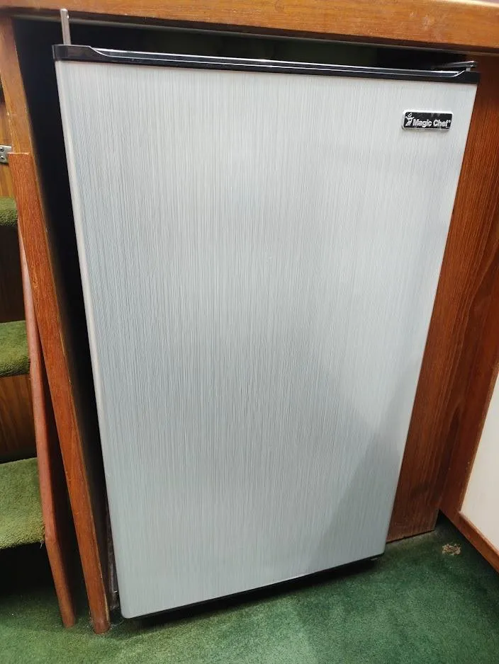 Slide: The Image of Magic Chef refrigerator in a 1988 Trojan F32 Sedan boat interior. - 48