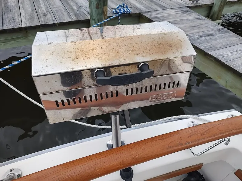 Slide: The Image of Stainless steel Magma grill mounted on a 1988 Trojan F32 Sedan boat. - 34