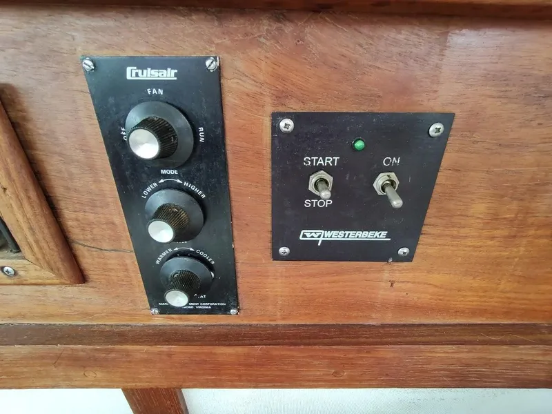 Slide: The Image of Control panel of a 1988 Trojan F32 Sedan with Cruisair and Westerbeke switches. - 41