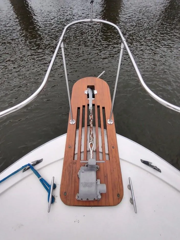 Slide: The Image of Bow of 1988 Trojan F32 Sedan with anchor chain and wooden platform. - 8