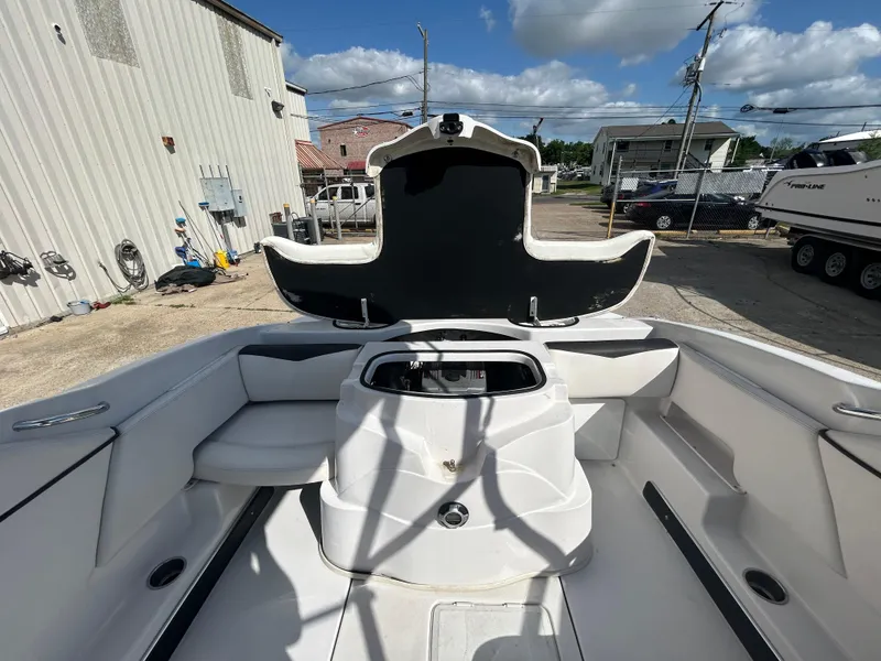 Slide: The Image of 2010 Four Winns H210 boat interior with open storage compartment. - 14