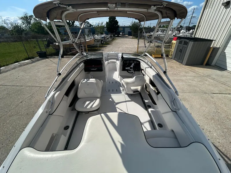 Slide: The Image of 2010 Four Winns H210 boat interior with seating and canopy. - 18