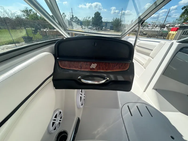 Slide: The Image of Interior of 2010 Four Winns H210 boat with glove compartment and seating. - 21