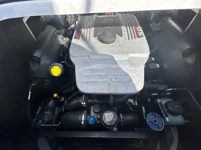 Slide: The Image of 2010 Four Winns H210 boat engine compartment with a 5.0L V8 engine. - 25