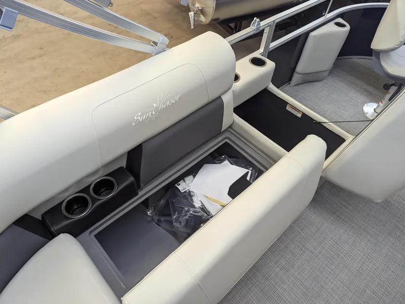 Slide: The Image of 2024 SunChaser Vista 16 Fish boat interior with storage compartment and cup holders. - 11