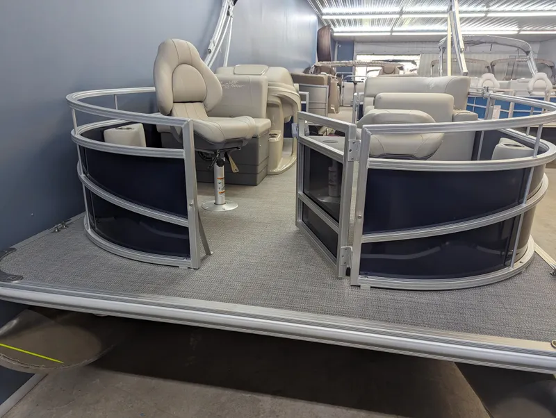 Slide: The Image of 2024 SunChaser Vista 16 Fish pontoon boat interior with seating and helm. - 2