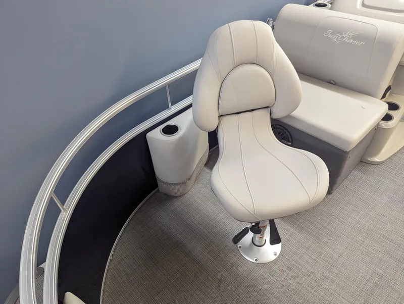 Slide: The Image of SunChaser Vista 16 Fish 2024 boat interior with swivel fishing chair and cushioned seating. - 3