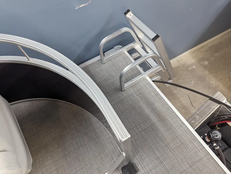 Slide: The Image of 2024 SunChaser Vista 16 Fish pontoon boat deck and ladder. - 9