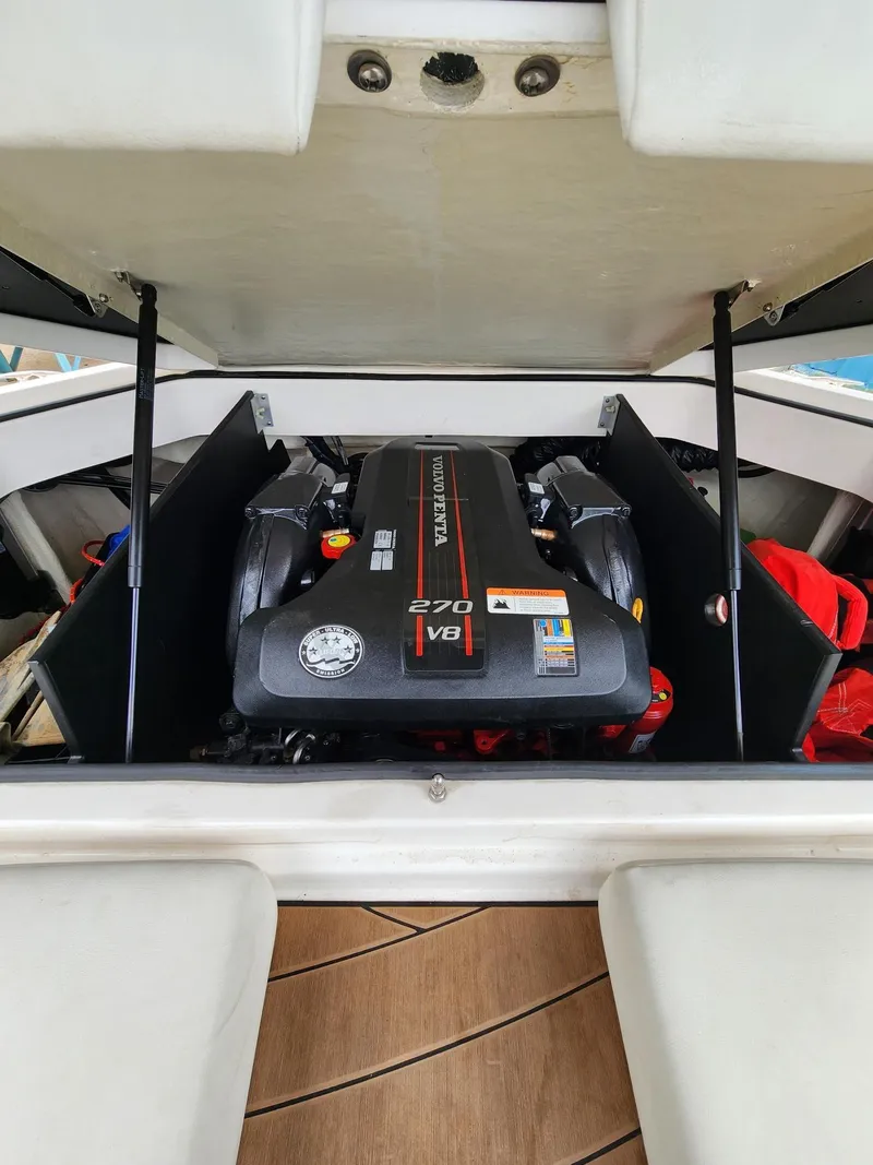 Slide: The Image of 2016 Regal 2100 Bowrider boat engine compartment with Volvo Penta 270 V8 engine. - 10
