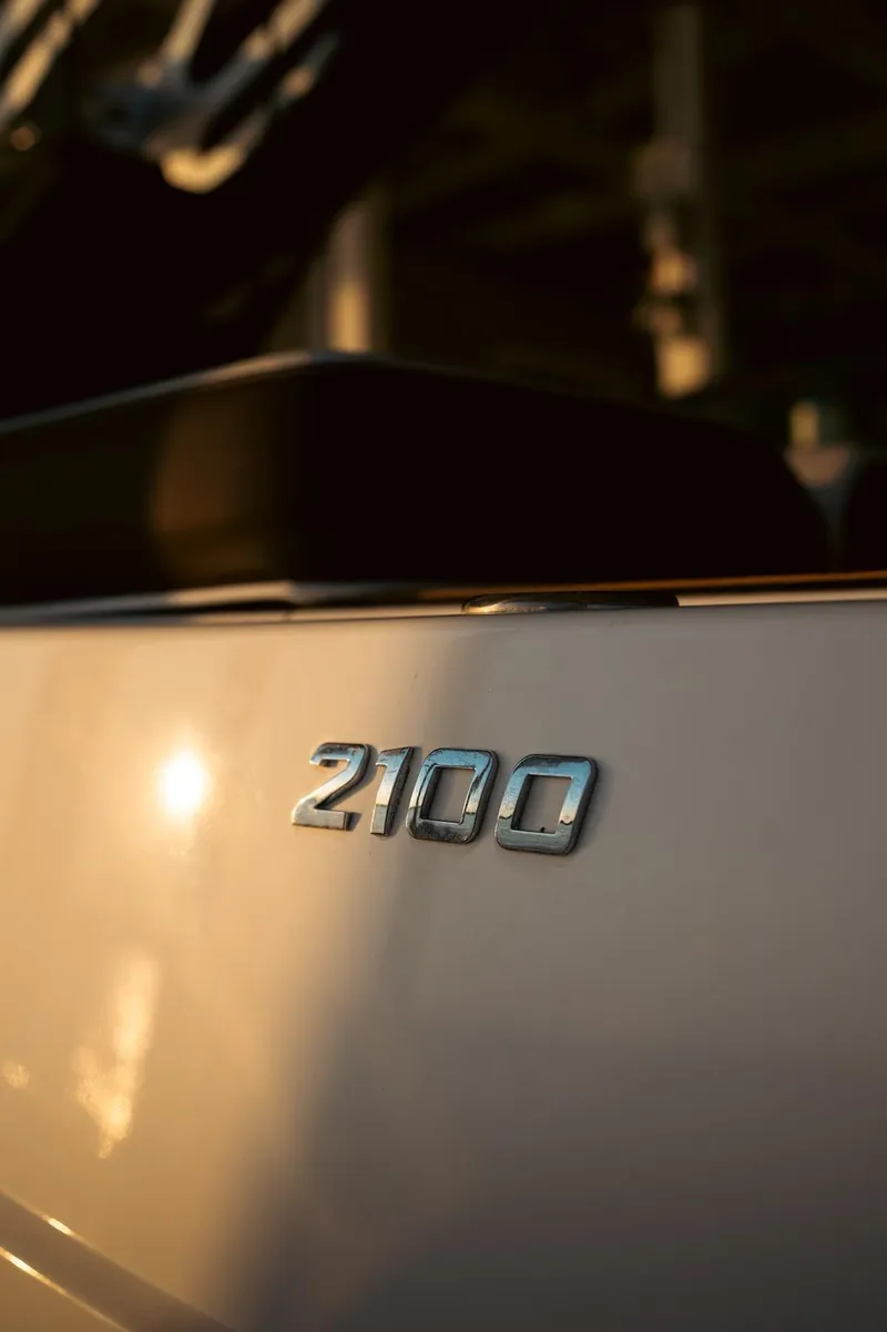 Slide: The Image of Close-up of 2016 Regal 2100 Bowrider boat emblem in sunlight. - 21