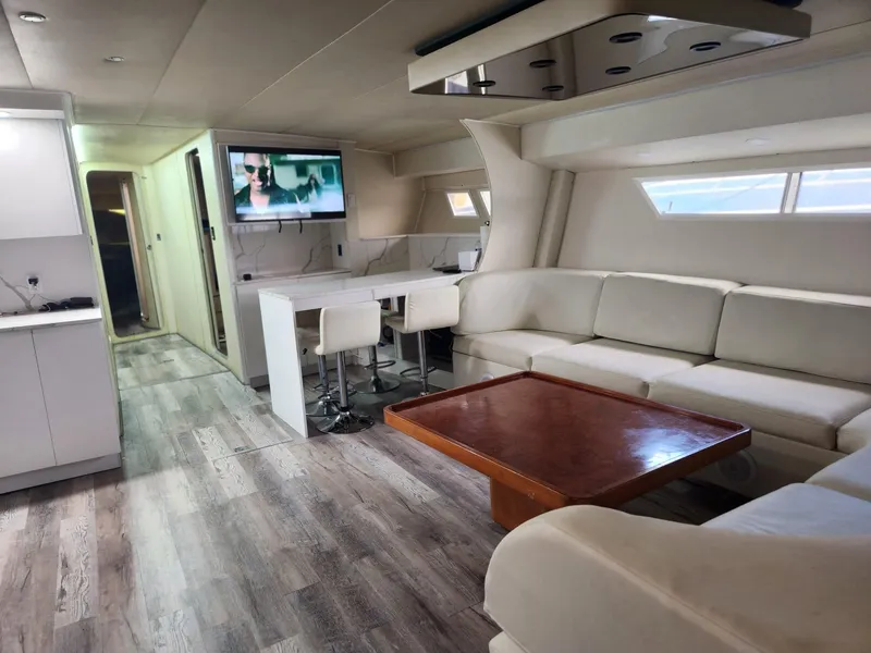 Slide: The Image of Luxurious interior of 1984 Infinity Express yacht with modern furnishings and entertainment system. - 13