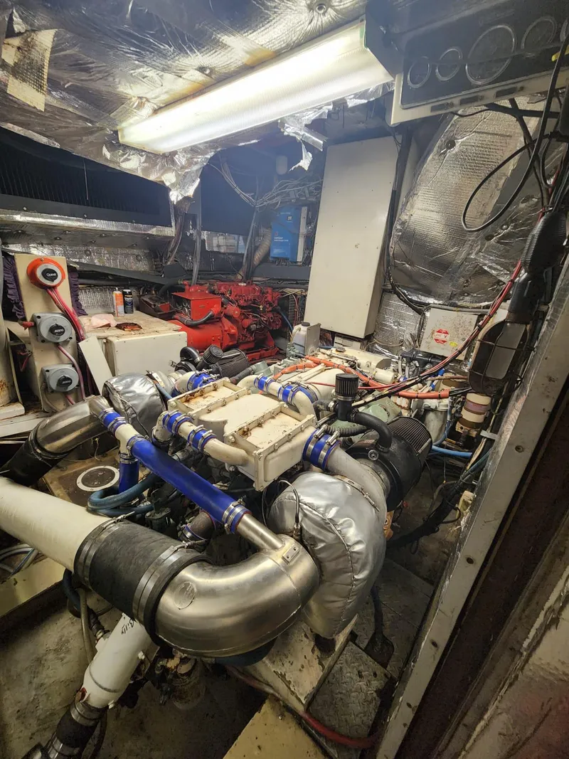 Slide: The Image of 1984 Infinity Express engine room with complex machinery and wiring. - 26