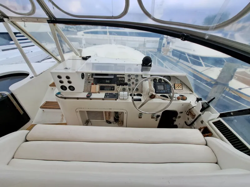 Slide: The Image of 1984 Infinity Express boat cockpit with steering wheel and control panel. - 7