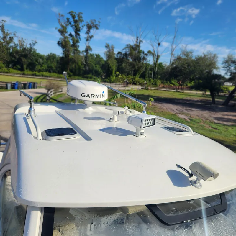 Slide: The Image of 2020 Pursuit OS 325 Offshore boat with Garmin radar and antennas. - 11