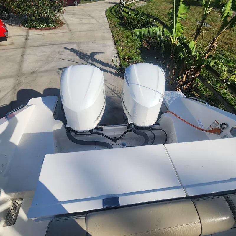 Slide: The Image of 2020 Pursuit OS 325 Offshore boat with twin outboard engines. - 13