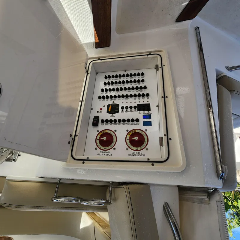 Slide: The Image of Electrical control panel on a 2020 Pursuit OS 325 Offshore boat. - 28