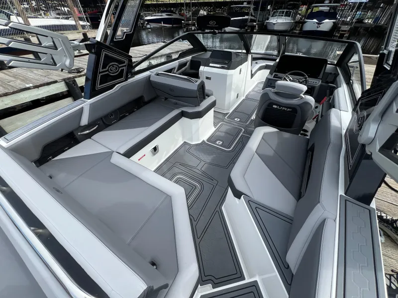 Slide: The Image of 2024 Cobalt R6 Surf boat interior with sleek seating and modern design. - 10