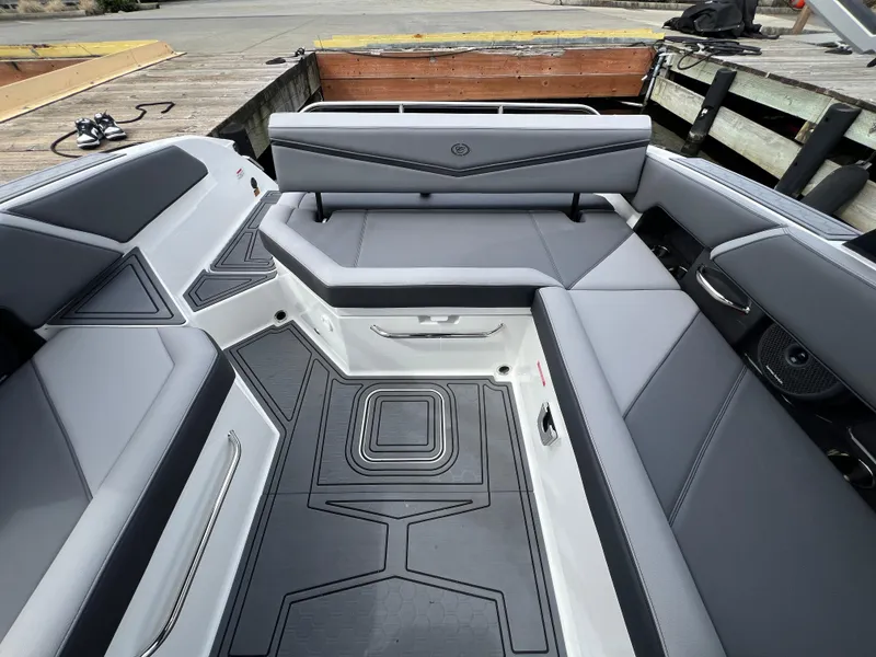 Slide: The Image of 2024 Cobalt R6 Surf boat interior with sleek gray seating and modern design. - 12