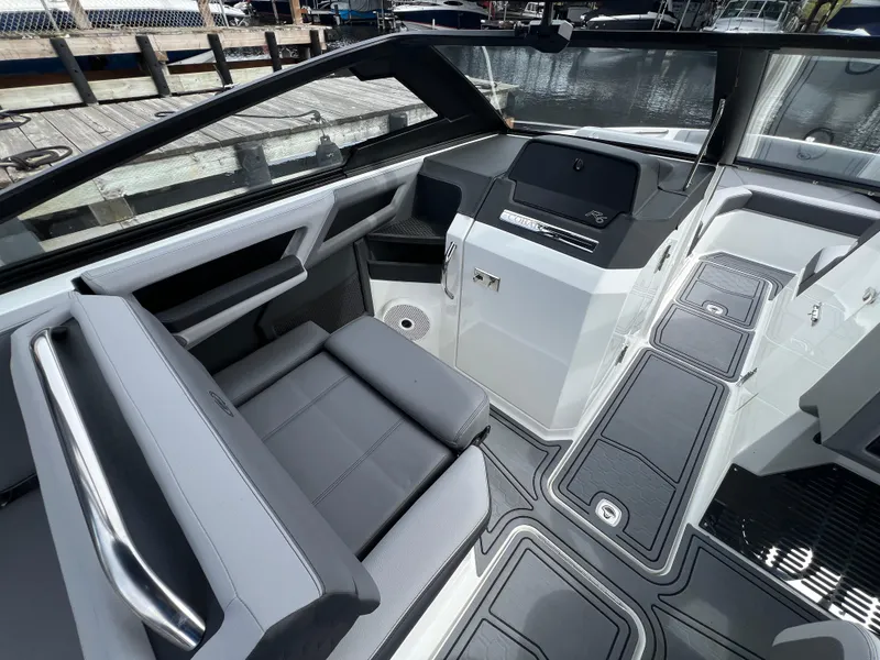 Slide: The Image of 2024 Cobalt R6 Surf boat interior with sleek seating and modern dashboard design. - 15