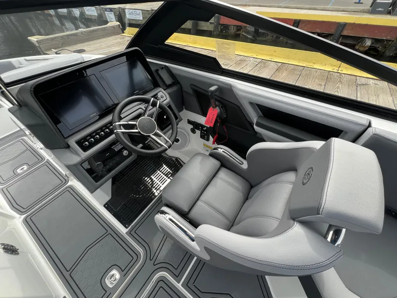 Slide: The Image of 2024 Cobalt R6 Surf boat interior with modern dashboard and comfortable seating. - 17