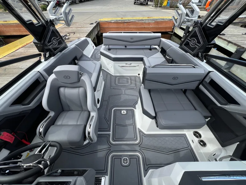 Slide: The Image of 2024 Cobalt R6 Surf boat interior with sleek gray seating and modern design. - 19