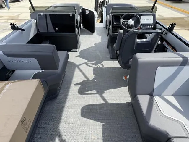 Slide: The Image of 2024 Manitou Cruise 22 Max Switchback V-Toon pontoon boat interior view. - 11