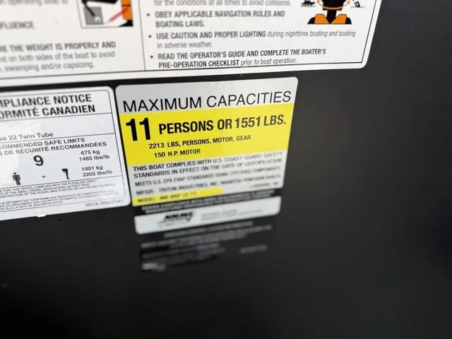 Slide: The Image of 2024 Manitou Cruise 22 Max Switchback V-Toon capacity label: 11 persons or 1551 lbs. - 14