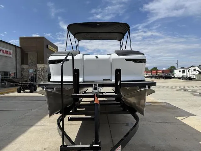 Slide: The Image of 2024 Manitou Cruise 22 Max Switchback V-Toon pontoon boat at dock, rear view. - 4