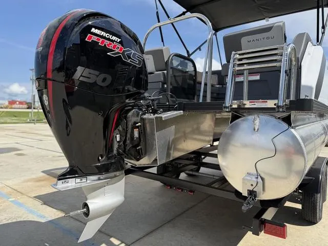 Slide: The Image of 2024 Manitou Cruise 22 Max Switchback V-Toon interior with gray and white seating. - 6