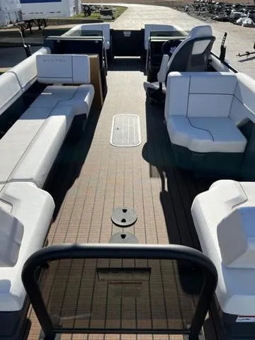 Slide: The Image of 2024 Manitou Explore 26 Switchback Single Engine V-Toon interior with spacious seating. - 10