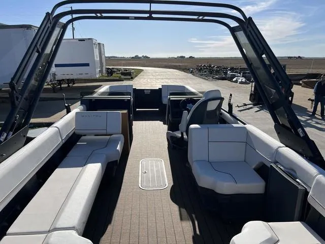 Slide: The Image of 2024 Manitou Explore 26 Switchback Single Engine V-Toon interior with spacious seating. - 11