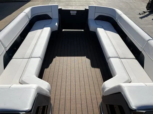 Slide: The Image of 2024 Manitou Explore 26 Switchback Single Engine V-Toon interior seating area. - 17