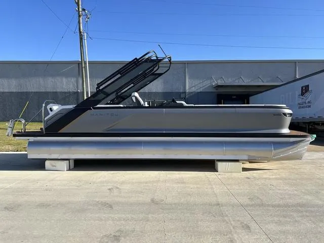 Slide: The Image of 2024 Manitou Explore 26 Switchback Single Engine V-Toon pontoon boat on display. - 2