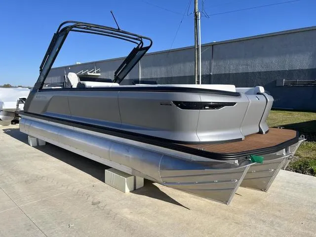Slide: The Image of 2024 Manitou Explore 26 Switchback Single Engine V-Toon pontoon boat on display. - 4