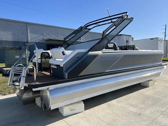 Slide: The Image of 2024 Manitou Explore 26 Switchback Single Engine V-Toon pontoon boat on display. - 5