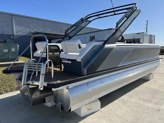 Slide: The Image of 2024 Manitou Explore 26 Switchback Single Engine V-Toon pontoon boat, rear view. - 6