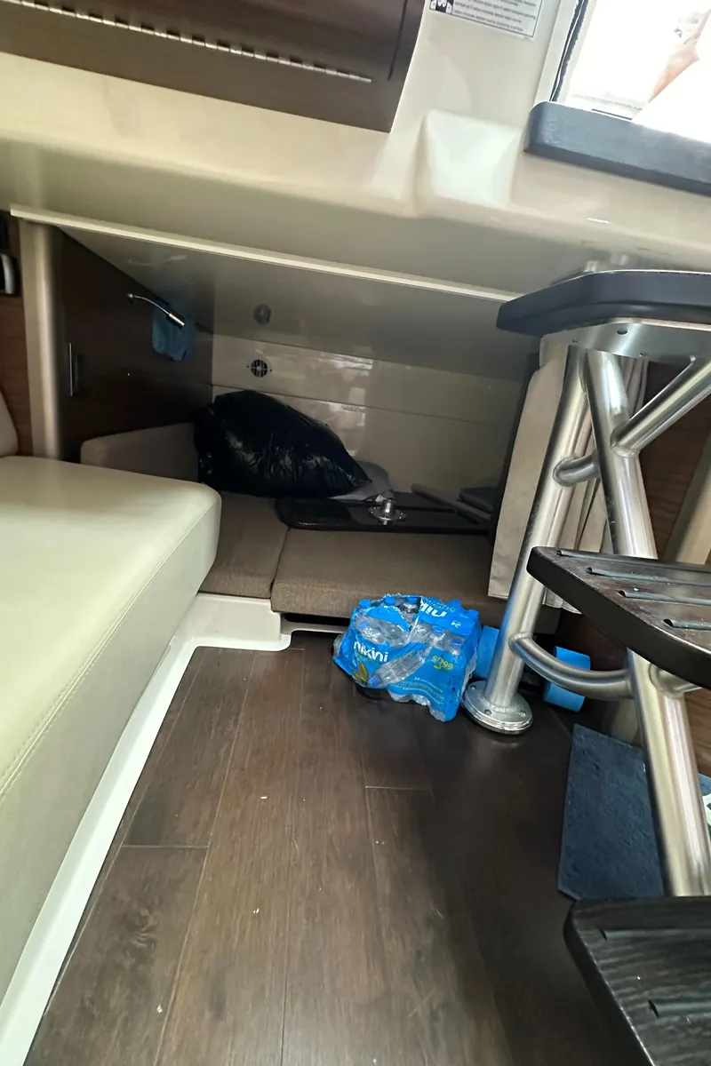 Slide: The Image of Interior cabin of 2015 Boston Whaler 345 Conquest with seating and storage. - 10