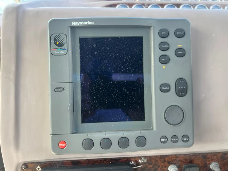Slide: The Image of Raymarine navigation system on 2003 Regal Commodore 3260 boat dashboard. - 14