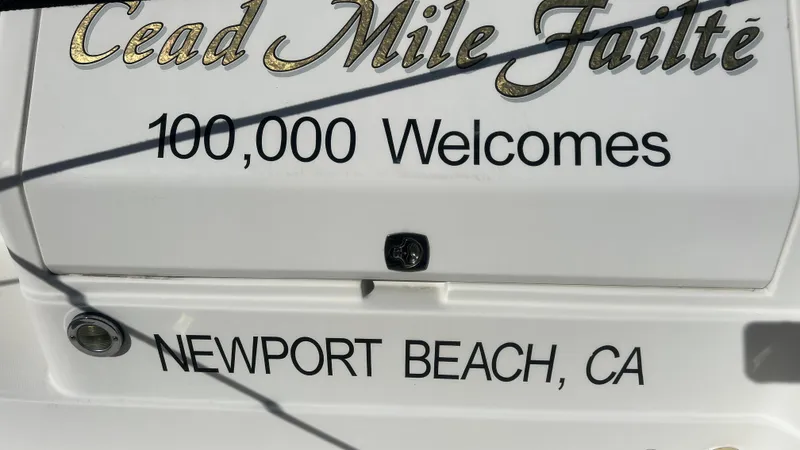 Slide: The Image of 2003 Regal Commodore 3260 boat with "Cead Mile Failte" and "Newport Beach, CA" text. - 19