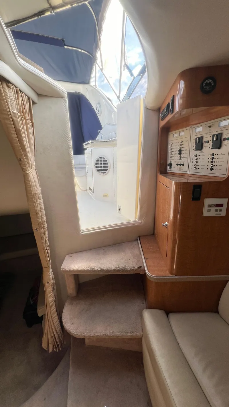 Slide: The Image of 2003 Regal Commodore 3260 yacht interior with control panel and steps. - 24