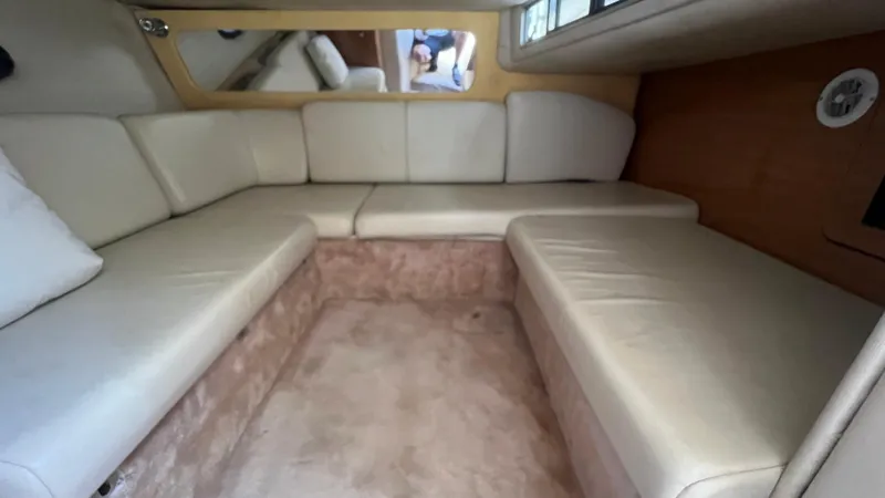 Slide: The Image of 2003 Regal Commodore 3260 interior with beige leather seating and carpeted flooring. - 26