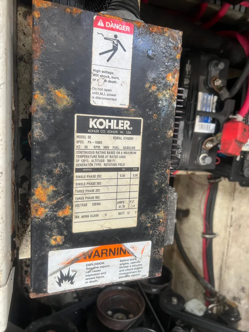 Slide: The Image of Rusty Kohler generator panel in a 2003 Regal Commodore 3260 boat engine compartment. - 34